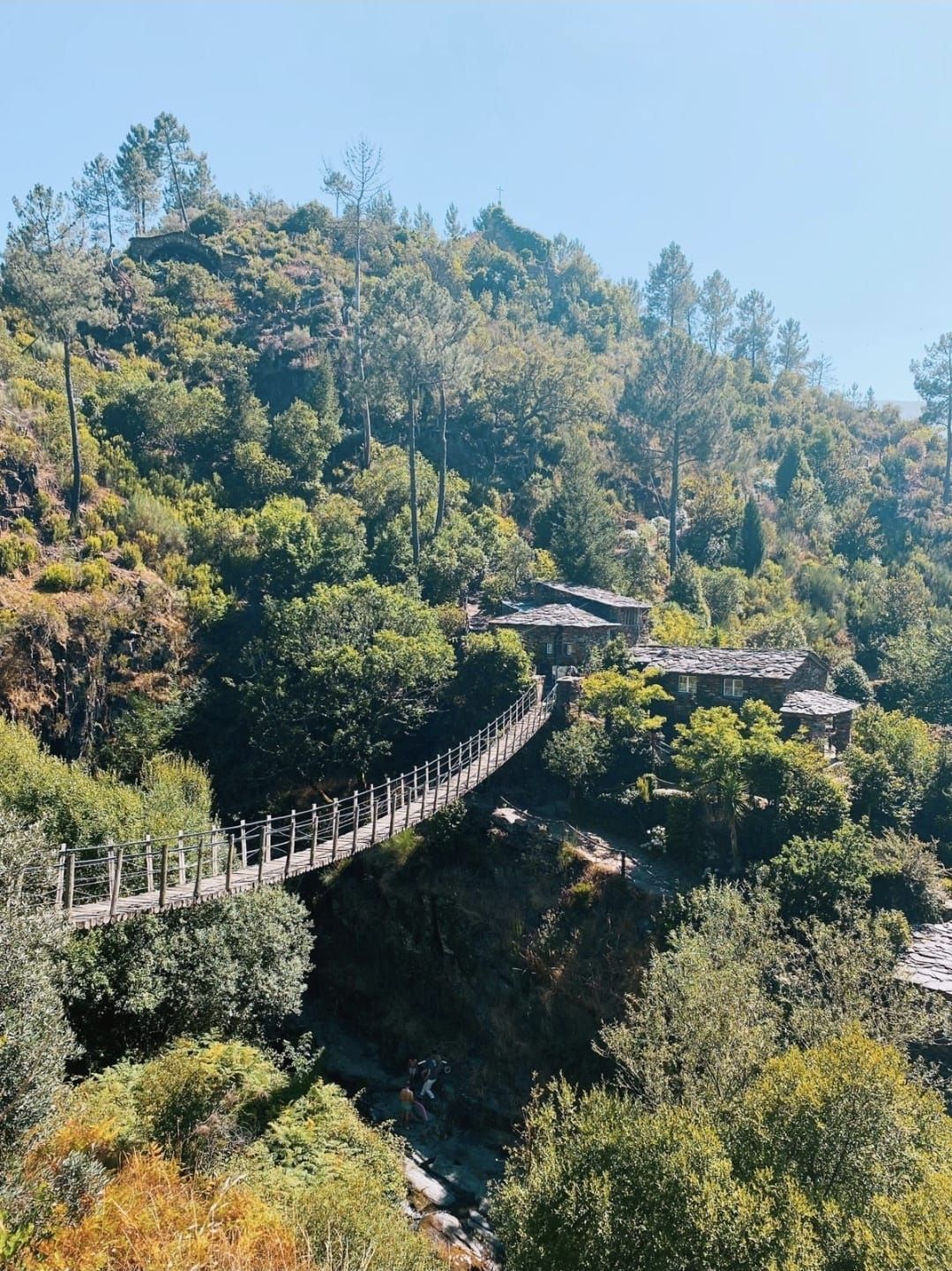 A wooden suspension bridge leading to one of the schist villages in the Serra do Açor